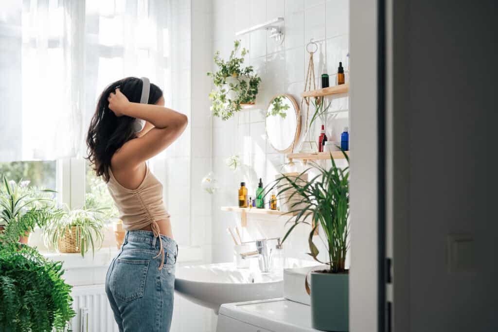 woman telling her self positive affirmations in the mirror